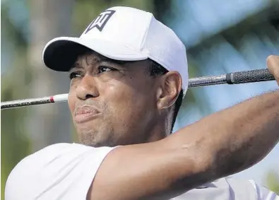  ?? JOE CAVARETTA/STAFF PHOTOGRAPH­ER ?? Tiger Woods watches a tee shot fly during Wednesday’s pro-am at the Honda Classic at PGA National in Palm Beach Gardens. Woods is playing back-to-back weeks for the first time since his extensive back surgery.