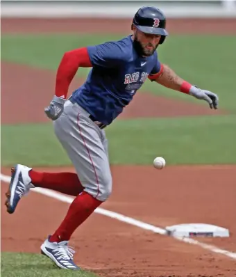  ?? MATT sTOnE / HErAld sTAFF; BElOW, sTuArT CAHIll / HErAld sTAFF ?? LOOK OUT: Kevin Pillar avoids being hit by a foul ball during an intrasquad scrimmage Friday at Fenway Park. Below, Red Sox owner John Henry takes in Saturday’s scrimmage with his family