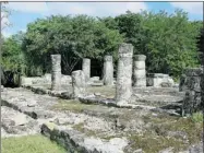  ??  ?? Pillars are the feature of the structure called Las Columnas at the Mayan ruins of San Gervasio on Cozumel Island. Pilgrims from the Mayan empire made trips to San Gervasio to pay tribute to Ix Chel, the goddess of the moon and fertility.