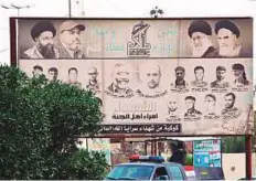  ?? AP ?? A poster depicting Iranian spiritual leaders and volunteer fighters of Popular Mobilisati­on Forces killed fighting Daesh in Basra, a sign of Iranian influence in Iraq ahead of the elections.