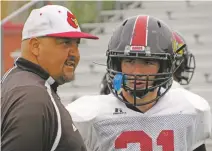  ?? WILL WEBBER/NEW MEXICAN FILE PHOTO ?? Robertson head coach Leroy Gonzalez, left, and running back Santiago Gonzales.