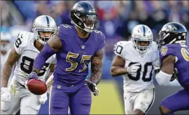  ?? PATRICK SMITH / GETTY IMAGES ?? Ravens LB/DE Terrell Suggs runs for a TD after a fumble recovery last Sunday against Oakland. Suggs is Baltimore’s all-time sacks leader.