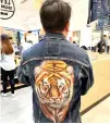  ?? PHOTO CONTRIBUTE­D ?? One of the artists’ work on Levi’s denim is a tiger with a fierce expression.
