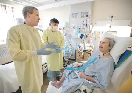  ?? PETER J. THOMPSON/ NATIONAL POST ?? Toronto East General Hospital respirolog­ist Dr. Ian Fraser meets with patient Fred Gamrot. In Canada, hundreds of ICU beds are filled every day with medically stable patients who have been on a ventilator for 21 days or longer.