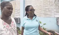  ??  ?? Mavis Farquharso­n (left), inspector of poor, at the Marie Atkins Shelter, and Mayor Dr Angela Brown Burke speak to The Gleaner along Hanover Street yesterday.