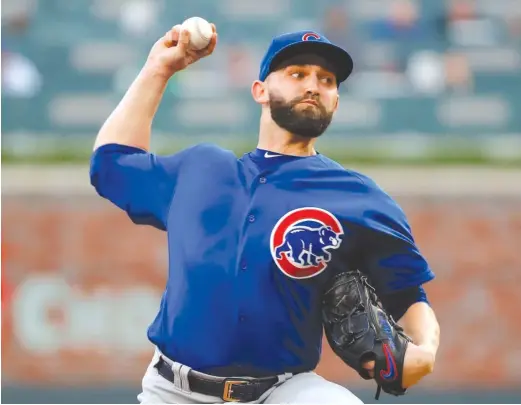  ?? KEVIN C. COX/ GETTY IMAGES ?? Tyler Chatwood, the major- league leader in walks, walked only two Wednesday but was pulled in the sixth inning with the score tied and one out.