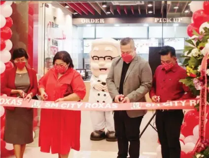  ?? EDITOR: KATLENE O. CACHO-LAUREJAS / business@sunstar.com.ph / KFC PH ?? OPENING. In early April, KFC and Big Bucket Ventures Inc. welcomed customers to the new KFC store at SM City Roxas. From left were KFC franchise management director Yvette Roldan; chief marketing officer Charmaine Pamintuan; SMRI Food Franchise Business- Big Bucket Ventures Inc. vice president Norman Zamora; and operations manager-VisMin Angelito Carreon.