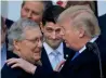 ?? AP ?? Donald Trump congratula­ting Mitch McConnell as Paul Ryan looks on at the White House in Washington. —