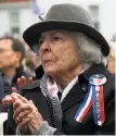  ??  ?? Nellie Picolotto honors her nephew during the Memorial Day ceremony at the Presidio.