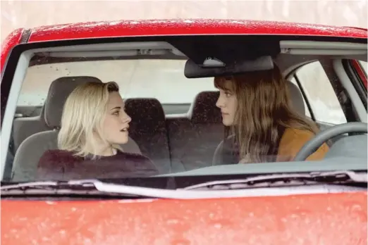  ?? HULU ?? Only when they are on the road to her hometown does Harper (Mackenzie Davis, right) reveal to girlfriend Abby (Kristen Stewart) that her family doesn’t know she’s gay in “Happiest Season.”