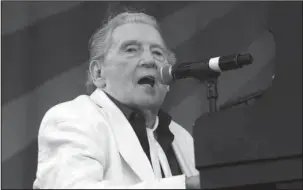  ?? The Associated Press ?? LEWIS: Jerry Lee Lewis performs at the New Orleans Jazz & Heritage Festival in New Orleans on May 2, 2015. Lewis is one of the early pioneers of rock ‘n’ roll music, but he doesn’t understand why his contributi­ons to country music haven’t been...