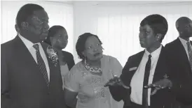  ??  ?? Midlands Provincial Magistrate Mrs Phathekile Msipa takes Acting President Emmerson Mnangagwa and his wife Cde Auxillia Mnangagwa on a tour of the new Mvuma court house yesterday