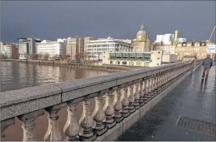  ?? Picture: Colin Mearns ?? MONEY MACHINE: Glasgow’s financial district. Despite gloomy prediction­s, the sector across the UK has seen a rise in hiring.