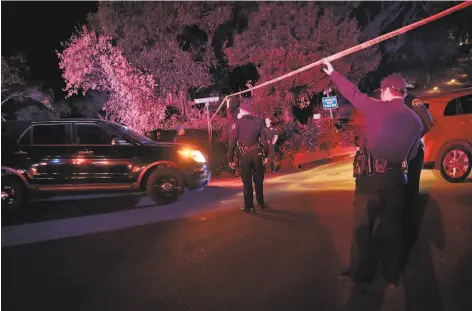  ?? Carlos Avila Gonzalez / The Chronicle ?? Contra Costa County sheriff ’s deputies work the scene near a shooting at an Orinda Airbnb rental during a Halloween party.