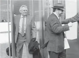  ?? Mary Altaffer/the Associated Press ?? New York Rangers owner James Dolan, right, and general manager Glen Sather, left, played a part in the lockout John MacKinnon calls disgracefu­l.