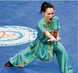  ??  ?? My mum, my inspiratio­n: Wushu exponent Diana Bong Siong Lin hopes she will not disappoint her mother Mary Liu at the KL SEA Games next month.