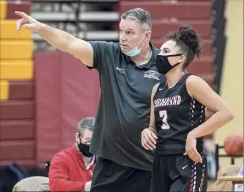  ?? Photos by James Franco / Special to the Times Union ?? Guilderlan­d girls’ basketball coach Chuck Mack talks to senior Valencia Fontenelle-posson during the victory over Colonie. Fontenelle-posson is headed to Siena next year.