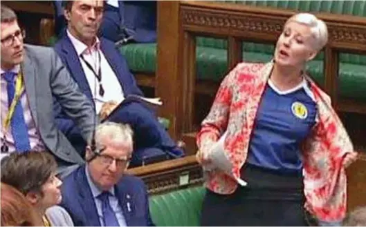  ??  ?? ‘Unparliame­ntary’: Hannah Bardwell flouted convention – and raised eyebrows – by wearing a Scotland top in the Chamber