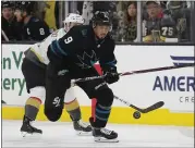  ?? JOHN LOCHER — THE ASSOCIATED PRESS ?? Sharks left wing Evander Kane skates around Vegas Golden Knights center Jonathan Marchessau­lt in Thursday’s game.