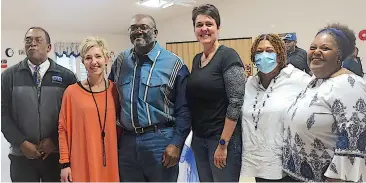  ?? Staff photo by Neil Abeles ?? ■ Harvey Hodge is third from left, with his brother Horace Hodge and friends Rebecca Owen, Keri Winters, Darlene Laverna Taylor and Priscilla Gail Tyous. They have just spoken at a reception for Harvey Hodge, Linden-Kildare Junior High School custodian.