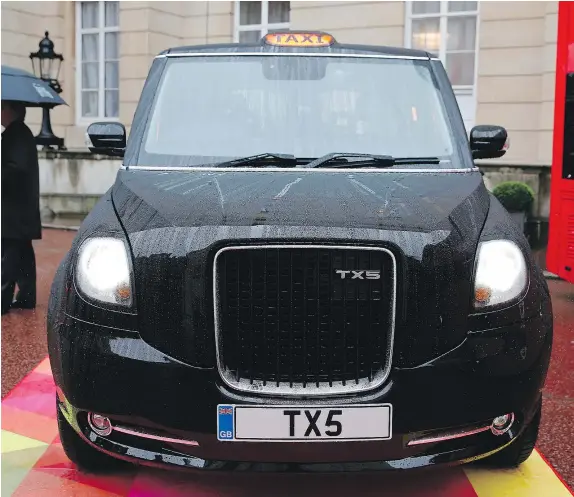  ?? — GETTY IMAGES ?? Geely, the manufactur­er of the famous London black cabs, opened a new 300-million pound plant in central England to produce the next generation of rechargeab­le hybrid Taxis, the TX5, to renew its British fleet and to expand internatio­nally.