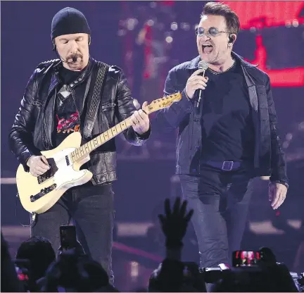  ?? THE ASSOCIATED PRESS/FILES ?? The Edge, left, Bono and the rest of U2 will play the entirety of their classic 1987 album, The Joshua Tree, at each stop during a summer stadium tour to celebrate the 30th anniversar­y of the 11-track album’s release.