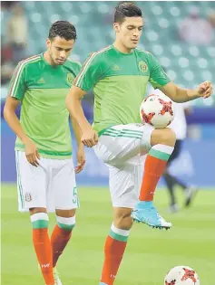  ??  ?? Mexico’s Raul Jimenez (right) warms up before the match against New Zealand in the FIFA Confederat­ions Cup Russia Group A match at Fisht Stadium in Sochi, Russia in this June 21 file photo. — Reuter photo