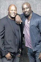  ?? Jay L. Clendenin Los Angeles Times ?? “LUKE CAGE” show runner Cheo Hodari Coker, left, and star Mike Colter buddy up at Comic-Con.