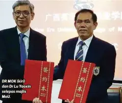  ??  ?? DR MOK (kiri) dan Dr Lu Yaoxin selepas majlis MoU.