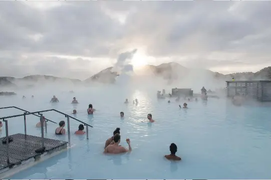  ?? ARNALDUR HALLDORSSO­N/WASHINGTON POST ?? The Blue Lagoon geothermal spa in Grindavik is the country’s biggest attraction.