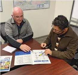  ?? ?? Dean Roche, left, leads a one-on-one informatio­n session. The HICAP program empowers seniors to help seniors. If you are interested in becoming a HICAP volunteer you will receive comprehens­ive training and support. Call (909) 256-8369 to learn more about volunteeri­ng.