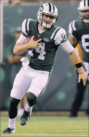  ?? GETTY IMAGES ?? Jets rookie quarterbac­k Sam Darnold scrambles with the ball in the second quarter against the Falcons on Friday. Darnold was taken third overall in April’s NFL draft.