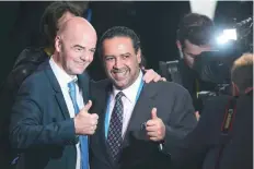  ?? — AFP ?? This file photo taken on February 26, 2016 shows then new President Gianni Infantino (left) posing with Kuwaiti Executive Member Sheikh Ahmad Al Fahad Al Sabah (right) after his first press conference in Zurich, following his election.