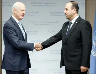  ??  ?? UN Special Envoy for Syria Staffan de Mistura and head of the Syrian Negotiatio­n Commission Nasr Hariri meet in Geneva on Tuesday. (Reuters)