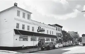  ?? JERRY JACKSON/BALTIMORE SUN ?? Eddie’s of Mount Vernon plans to relocate to space on the ground floor of the Belvedere condo building a block away to make way for an apartment project.