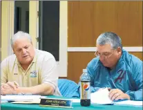  ?? GINGER REILLY, SPECIAL TO THE TRIBUNE ?? Homer Township Highway Commission­er Mike De Vivo, left, sits with Trustee John Kruczek at a 2018 Homer Township Board meeting.