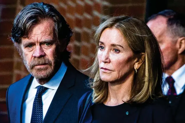  ?? Photograph: Boston Globe/Getty Images ?? Felicity Huffman and her husband William H Macy walk out of the courthouse in Boston on 13 September 2019.