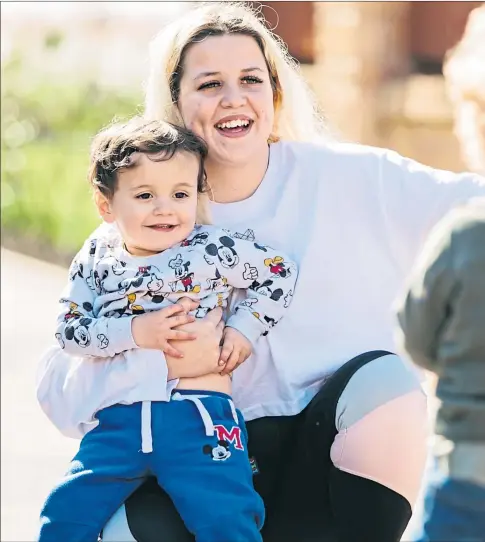  ??  ?? Alfie, right, runs towards mum Leigha and little brother Hayes as they meet for the first time in a year at her