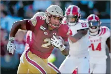  ?? MICHAEL DWYER/AP FILE PHOTO ?? Boston College running back AJ Dillon of New London runs for a touchdown during a game against NC. State on Oct. 19.