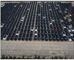  ?? (Bloomberg News WPNS/Qilai Shen) ?? Tesla vehicles waiting for shipping fill a large lot near the Waigaoqiao Container Port in Shanghai on June 3.