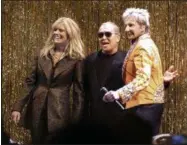  ?? RICHARD DREW—ASSOCIATED PRESS ?? Designer Michael Kors, center, is joined by model Patti Hansen and Barry Manilow on stage after his collection was modeled during Fashion Week in New York, Wednesday, Feb. 13, 2019.