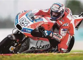  ?? AFP PIC ?? Ducati’s Andrea Dovizioso negotiates a corner during second practice for the Malaysia MotoGP at Sepang Internatio­nal Circuit yesterday.