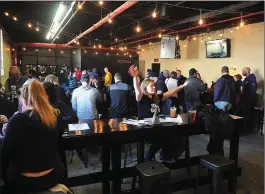  ?? Photo by Ernest A. Brown ?? A packed house is on hand for the 3rd annual Torch Run Super Plunge Special Olympics Benefit held at the new home of Ravenous Brewery in Cumberland on Saturday.