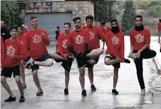  ??  ?? PALESTINIA­NS and internatio­nals during a Santa marathon as part of Christmas celebratio­ns in the West Bank town of Beit Jala. EPA-EFE| AL HASHLAMOUN