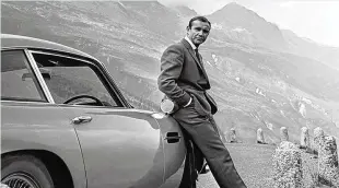  ??  ?? Sean Connery poses as James Bond in “Goldfinger,” the third of the Connery Bonds that establishe­d many tropes of the series, including a tricked-out AstonMarti­n DB5.