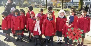  ??  ?? ●●Pupils from Beech House school at the Armistice Day service at Rochdale Cenotaph