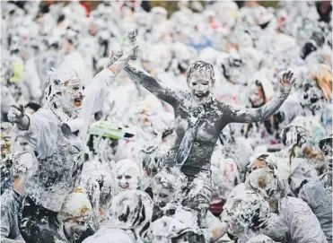  ??  ?? 0 St Andrews students take part in the university’s annual foam fight on Raisin Monday