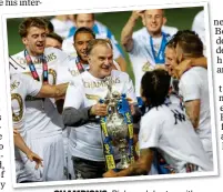  ??  ?? CHAMPIONS: Bielsa celebrates with Leeds after winning the Championsh­ip