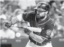  ?? JONATHAN NEWTON/THE WASHINGTON POST ?? Nationals right fielder Adam Eaton attempts a bunt during a regular-season game against the Brewers.