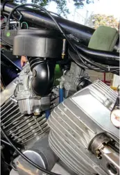  ??  ?? Rubber manifolds from a later model replaced the 350’s leaky old air intake arrangemen­t